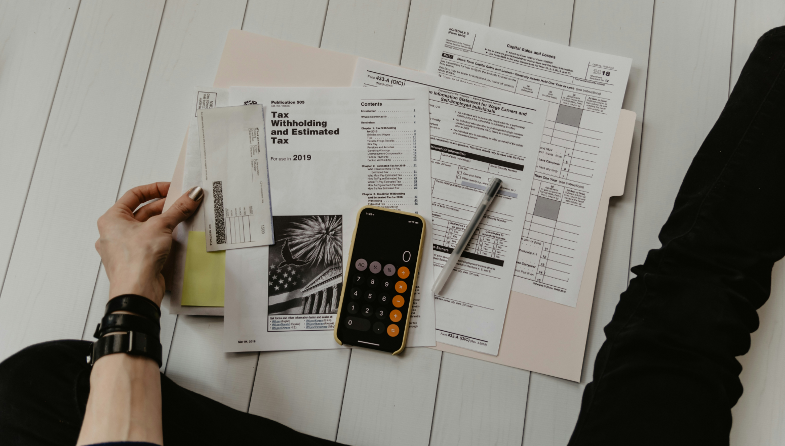 Financial controller reviewing clean cash flow statements, reconciliations, and tax compliance