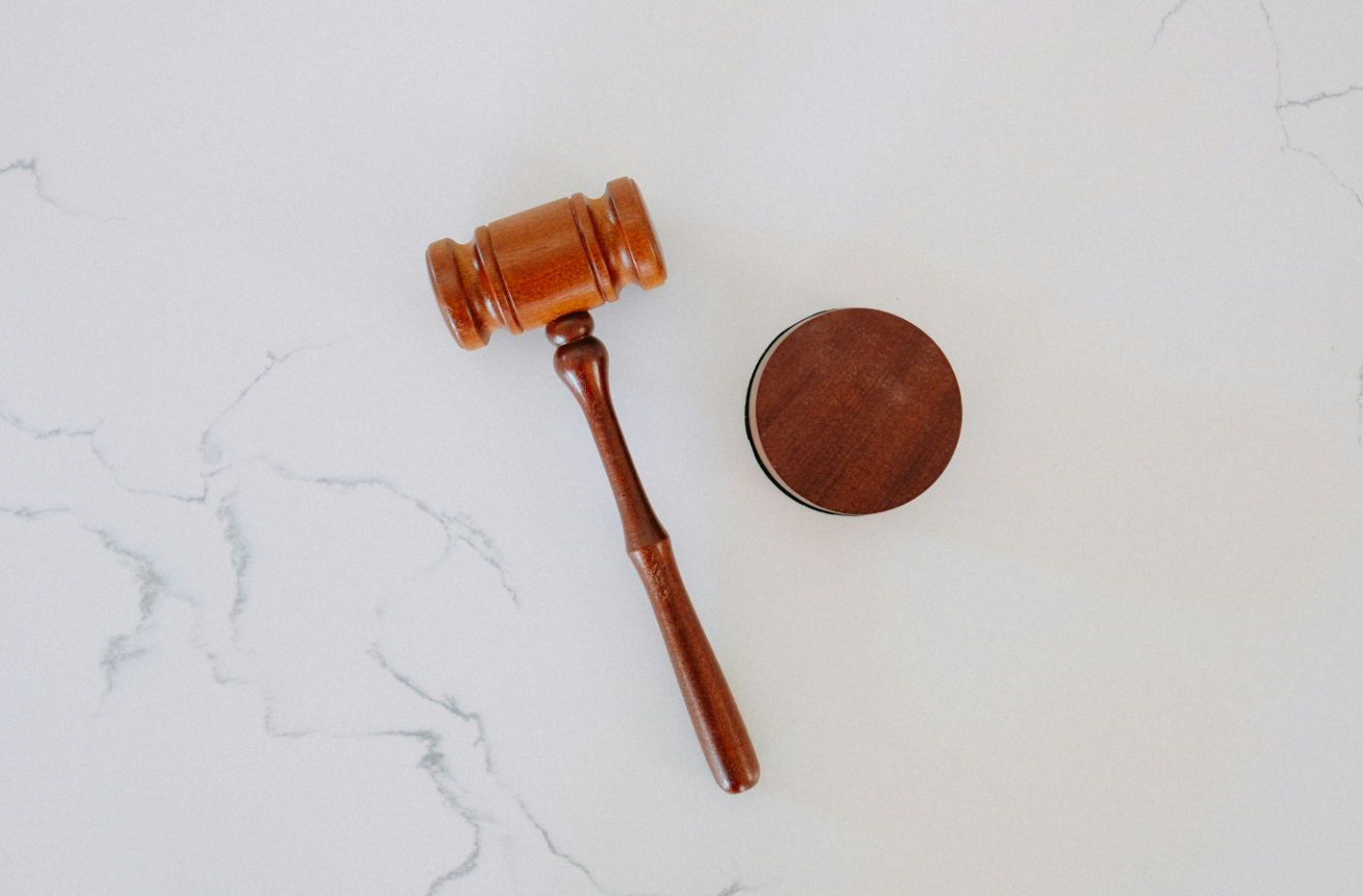 Legal counsel drafting commercial service agreements and international regulatory compliance terms